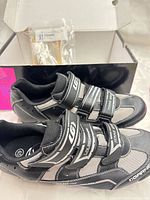 Pair of Louis Garneau cycling shoes in front of original box, size label visible