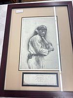 Full view of framed portrait showing image, mat and plaque