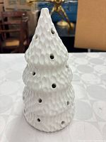 Full view of white ceramic Christmas tree