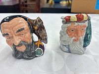 Front view of both mugs on table