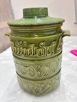 Front view showing Rumtopf wording and fruit relief