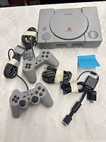 Console with controllers and cables laid out