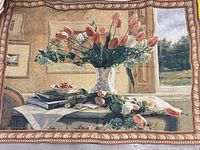 Front view showing full floral still life tapestry and woven border