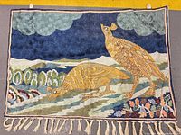 Full view of tapestry showing complete design, fringe and hanging loops