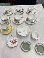 Full lot showing teacups, saucers, plates and bowls