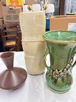 Three vases grouped: brown, cream, green