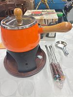overall fondue set with pot, stand, skewers, ladle, box