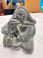 Front view of Wolf Original Inuit mother and child sculpture