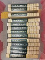 Stack of World Book Year Book volumes showing spines and uniform design