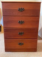 Front view showing four drawers with bail pulls