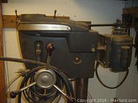 Side view of drill press showing column, head and three-spoke feed handle