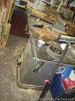 Angled view of table saw showing cast iron top and support base