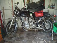 Side view of black Yamaha XS1100 motorcycle showing frame, engine and seat
