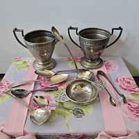 Group view of all silver-plate items laid out