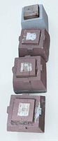 Top view of four concrete blocks showing colors and wood inserts