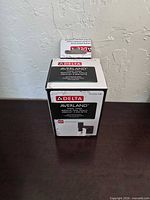 Boxed Delta Averland AVE35-MB towel hook, front view