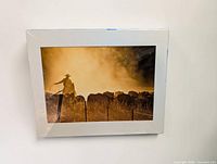 Front view of matted cowboy cattle print in shrink wrap