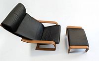 Top view of armchair with ottoman showing overall design and materials