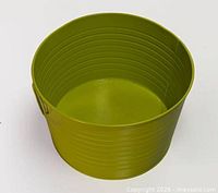 Top view of lime green ribbed metal planter showing interior