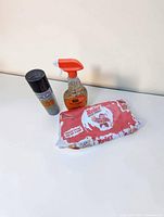 all three BBQ cleaning items: spray bottle, aerosol can, wipes
