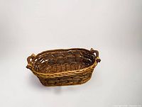 oblique view showing basket shape, weave, handles