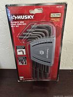 Front view of sealed Husky 13-piece MM long arm hex key set in packaging