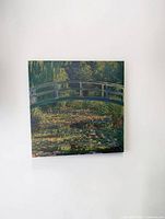 Front view of stretched canvas print depicting bridge and pond