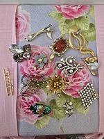 Group shot of all 12 brooches laid out