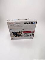Front of sealed MYGUARD Smart Laundry Shut Off System box