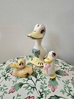 Front view of all three ceramic duck figurines