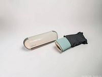 Silhouette Portrait machine with rolled cutting mat and carry pouch