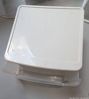 Top view showing white lid and drawer front