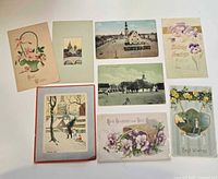 Fronts of eight early 20th-century postcards showing floral, scenic and winter designs