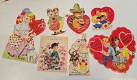 Fronts of seven colorful vintage Valentine cards