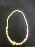 Full view of beaded necklace laid flat