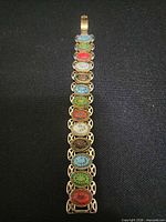 Front view showing full length of bracelet with multicolored cameos