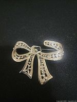 Front view showing bow shape and rhinestones