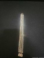 Full view of five-row sterling silver bracelet with box clasp