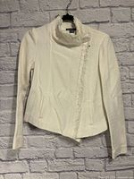 Full front view of Vince moto jacket on hanger