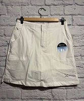 Front view of Arctix skort on hanger showing overall design