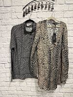 Chaser leopard print top and Cuddl Duds zebra print top on hangers