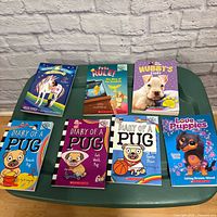 All seven children’s books laid flat showing front covers