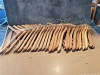 All 25 wooden hangers stacked