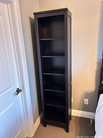 Front angled view showing espresso finish and six shelves