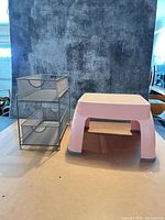 Stool and organizer side by side showing size and form