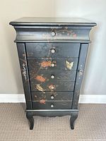 Front view showing full armoire with painted design
