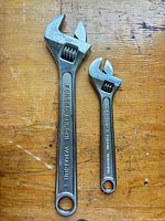 Both adjustable wrenches side by side showing overall condition and size difference