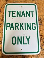 Front view of entire sign showing text and mounting holes