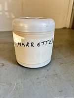 White plastic tub labelled 'MARR ETTES'