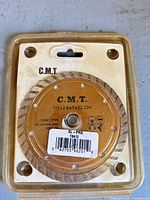 Front view of packaged C.M.T. XL-PRO 115 mm turbo diamond saw blade showing model and UPC